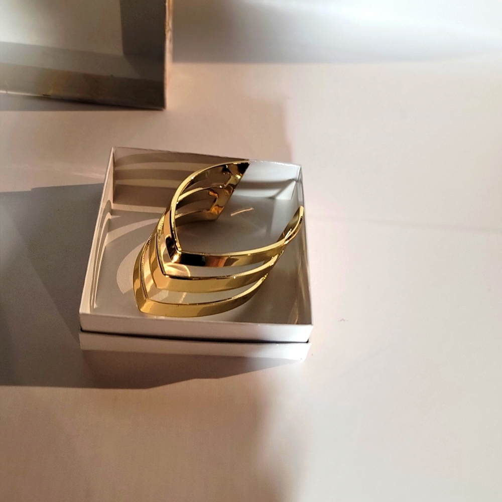 BRACELET-  Gold color- . Hard &  sturdy  not flexible. Not need  clip closure.